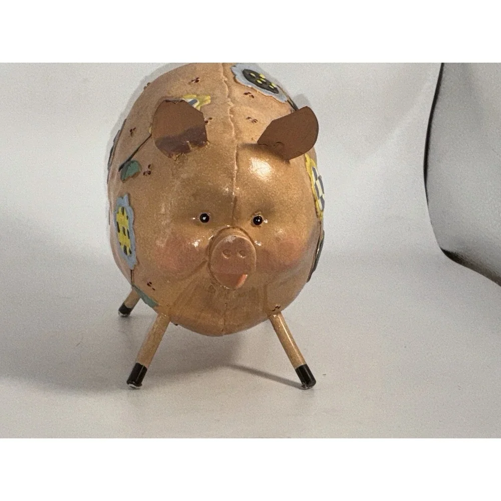 Floral Decorated Pig With Curly Tail And Cute Ears Made Of Metal?